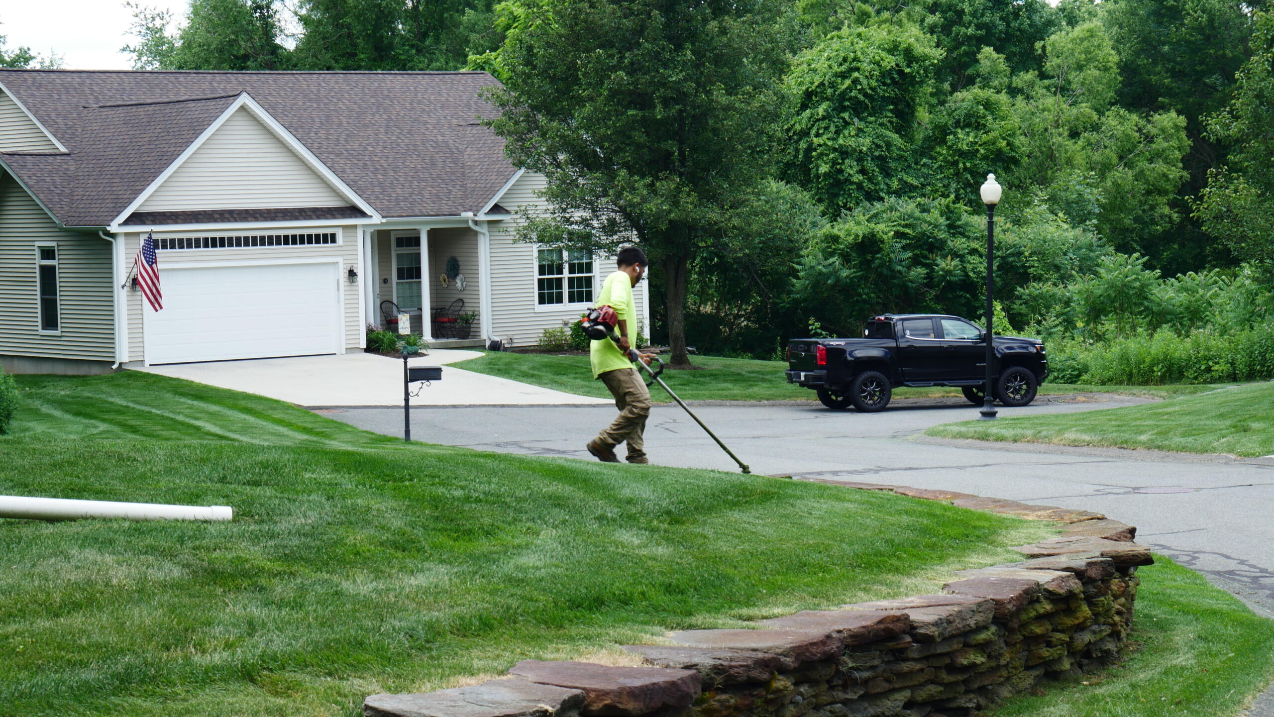 Lawn edging and string trimming service at a residential home in Western Massachusetts
