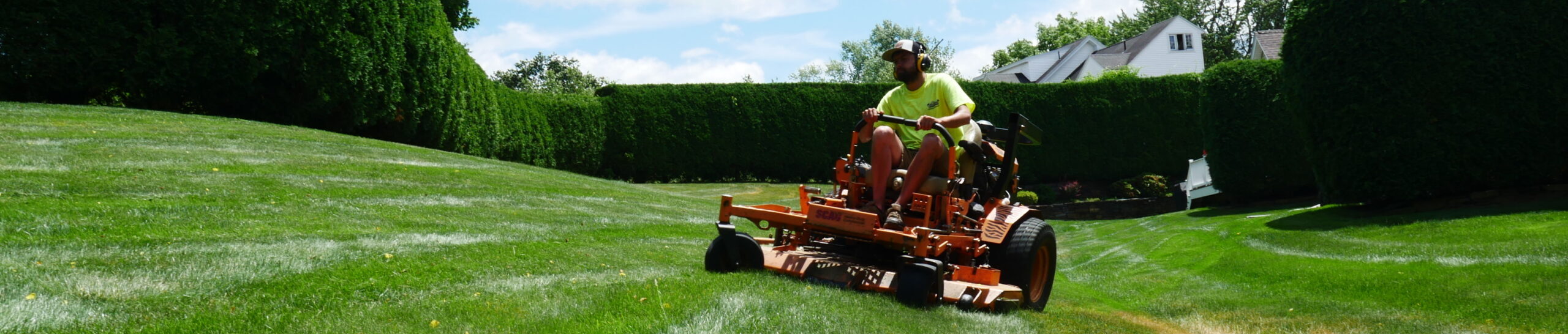 Professional residential lawn mowing service in Western Massachusetts using a commercial zero-turn mower